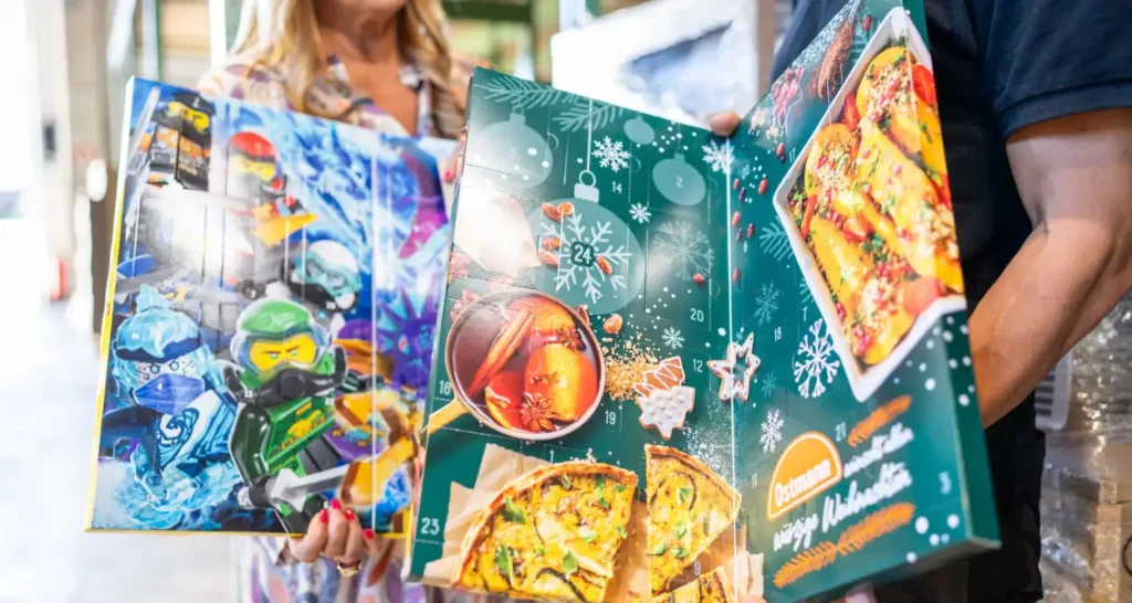 Opened book-style advent calendar by Ostmann with visible spice samples.